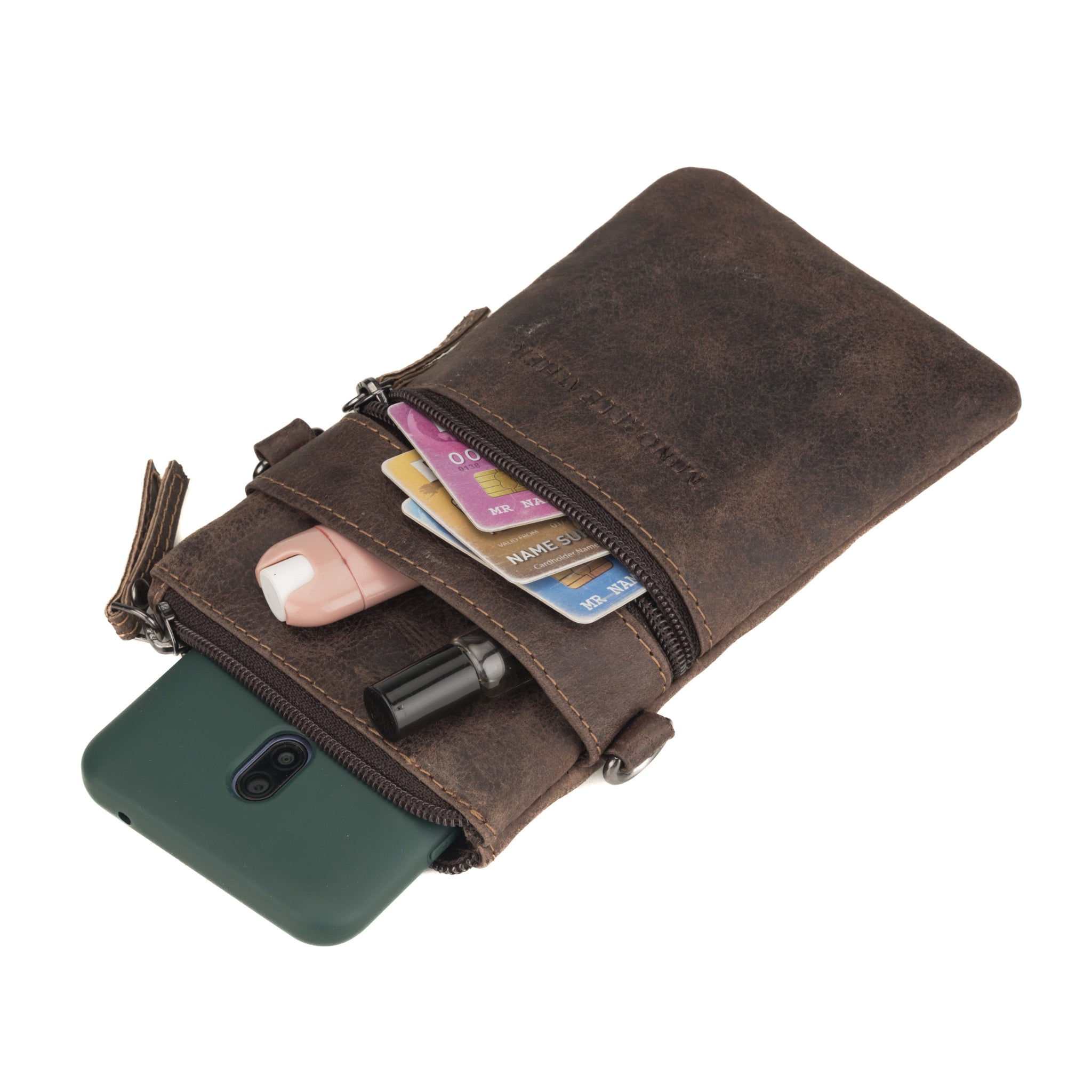 Minori Leather Ashford unisex brown leather sling bag with adjustable strap and compact design.