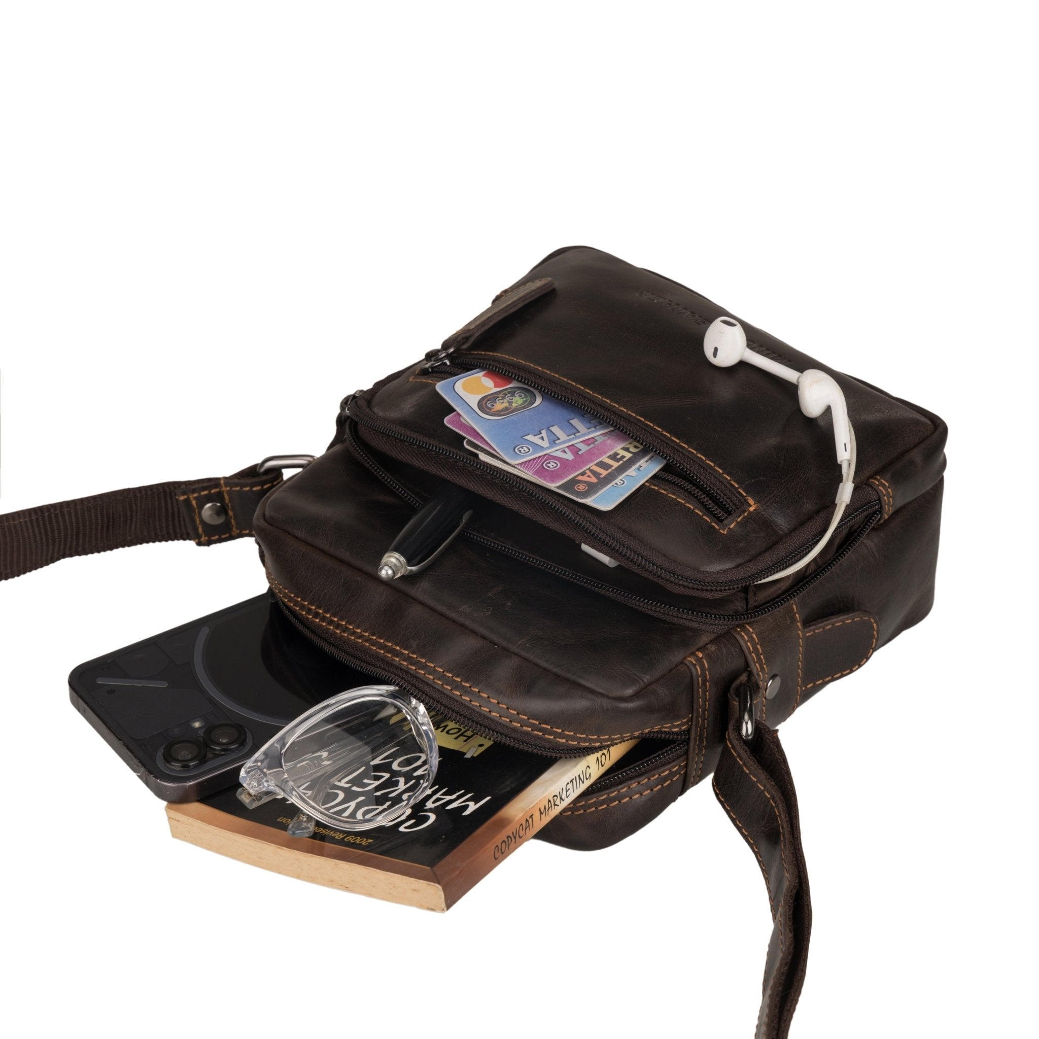 Minori Leather Cove brown leather crossbody bag with adjustable strap and sleek design.
