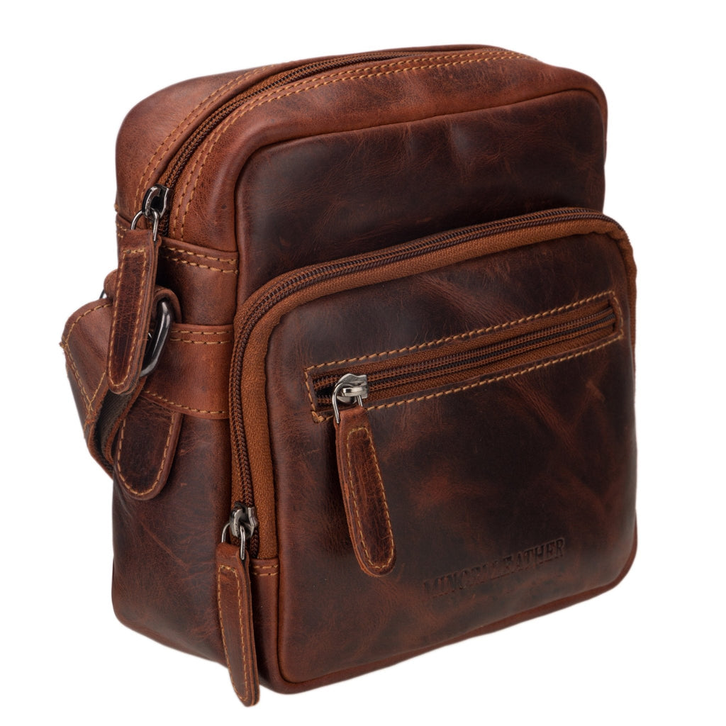 Minori Leather Cove crossbody bag in chestnut leather with adjustable strap and compact design.