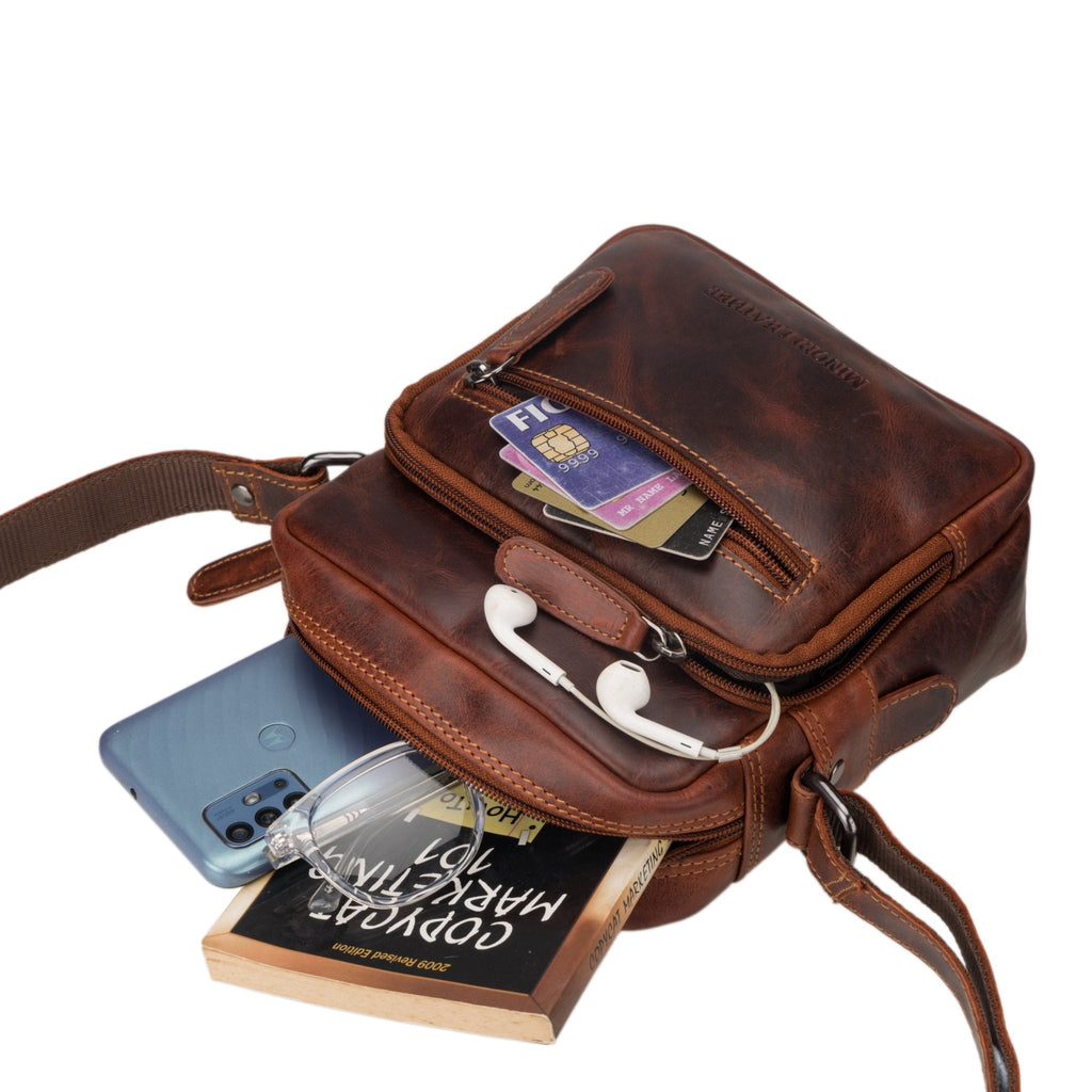 Minori Leather Cove leather crossbody bag in chestnut with adjustable strap and sleek design, ideal for everyday use.