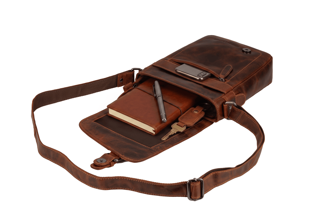 Minori Leather Dallas leather crossbody bag in chestnut color, featuring a sleek design and adjustable strap.