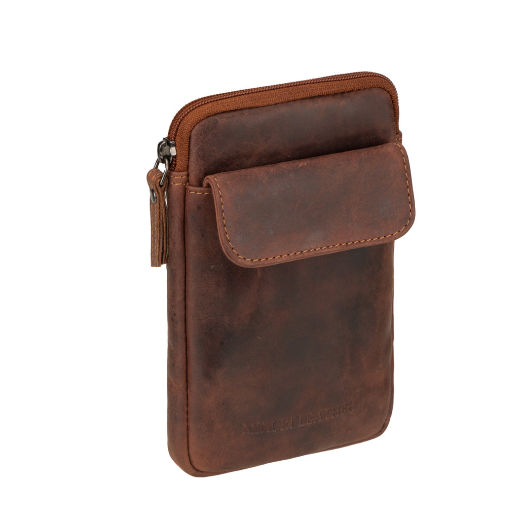 Minori Leather Freya unisex leather sling bag in chestnut color, featuring a compact design with adjustable strap and sleek style.