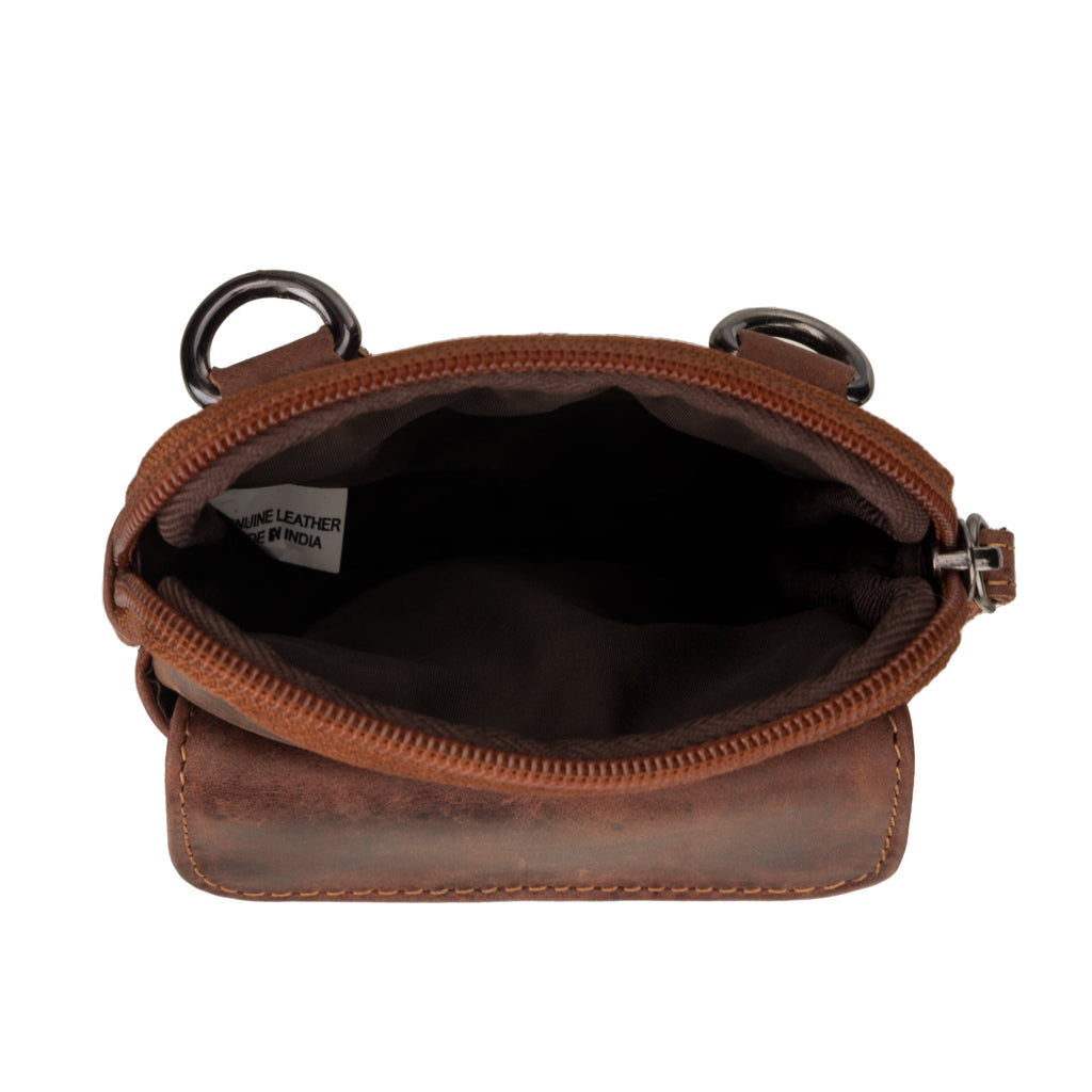 Minori Leather Freya unisex leather sling bag in chestnut, featuring sleek design and adjustable strap for everyday use.