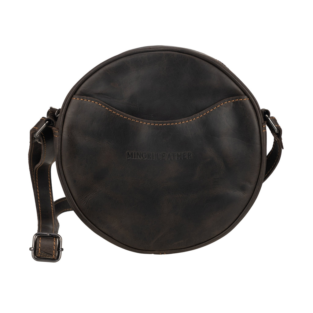 Minori Leather Luna leather crossbody bag in chestnut and hair-on brown with round shape and adjustable strap, stylish women's accessory.
