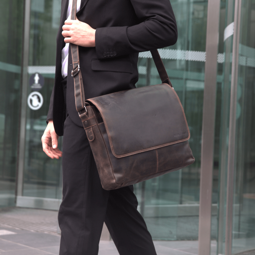 Richmond full grain leather 16-inch men's laptop messenger bag in brown by Minori Leather, with adjustable strap and front pocket.