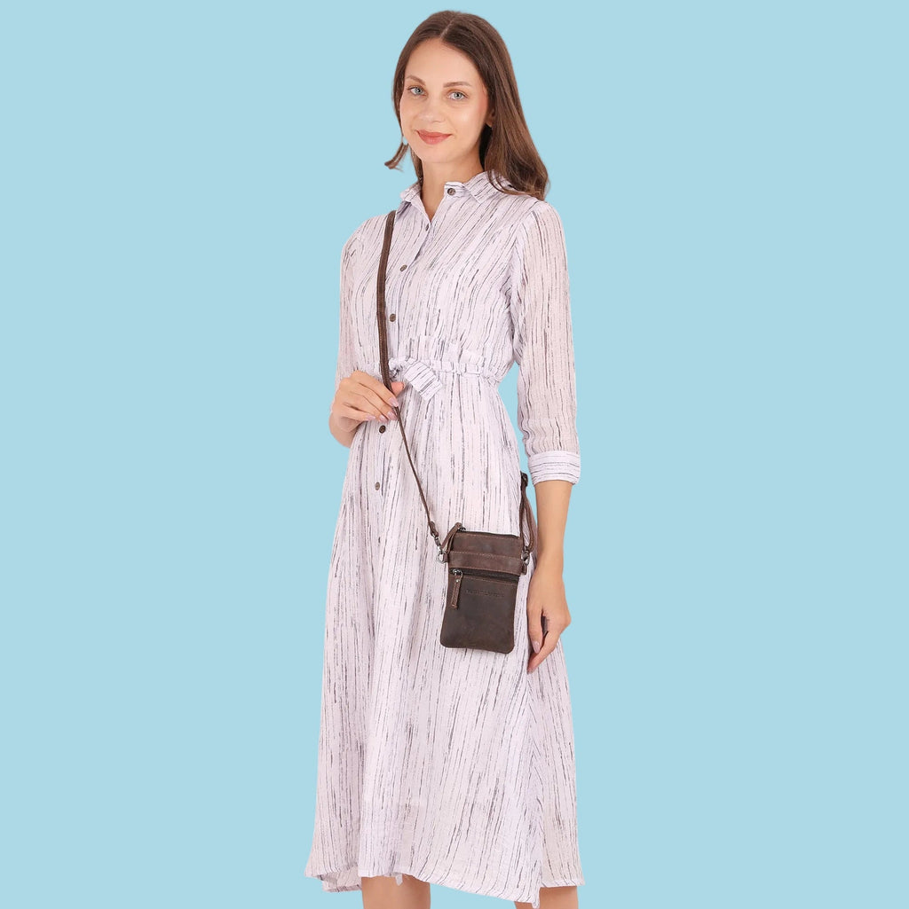 Minori Leather Ashford brown leather sling bag for unisex wear, featuring adjustable strap and compact design.