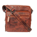 Minori Leather Harbor Chestnut leather crossbody bag with adjustable strap and spacious interior.