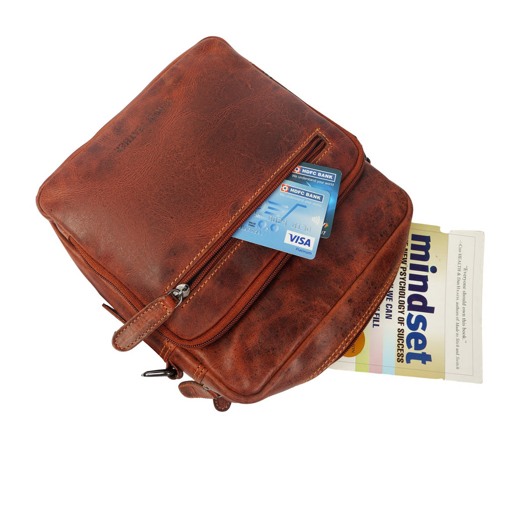 Minori Leather Harbor leather crossbody bag in chestnut with adjustable strap and sleek design.