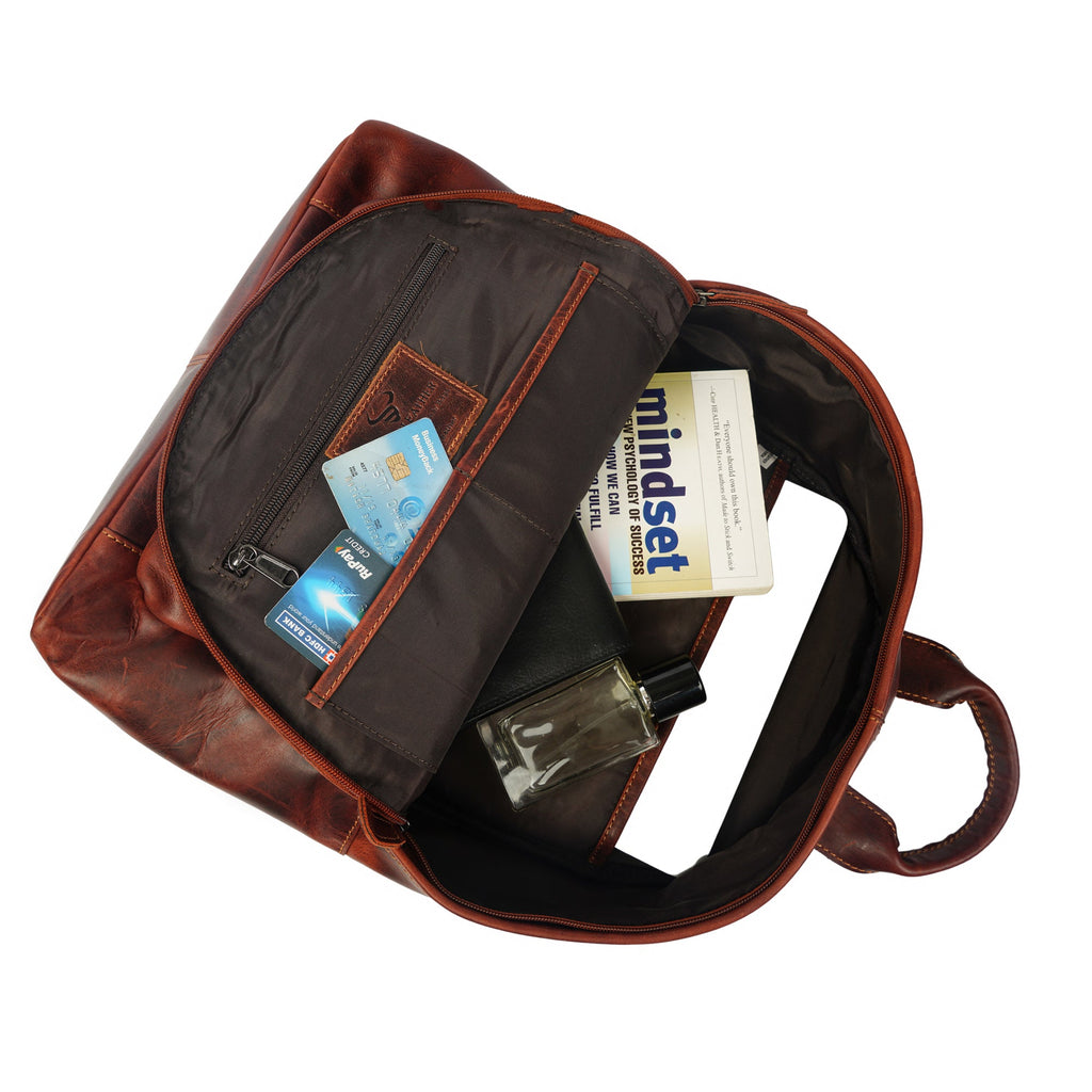 Minori Leather Garth Leather Backpack showing brown leather material, adjustable straps, and front pocket details.