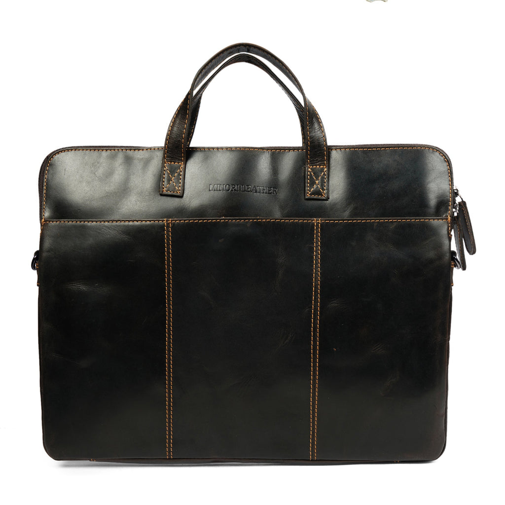 Minori Leather Atlas leather laptop sleeve in brown for 14-inch laptops, unisex design with sleek, durable craftsmanship.