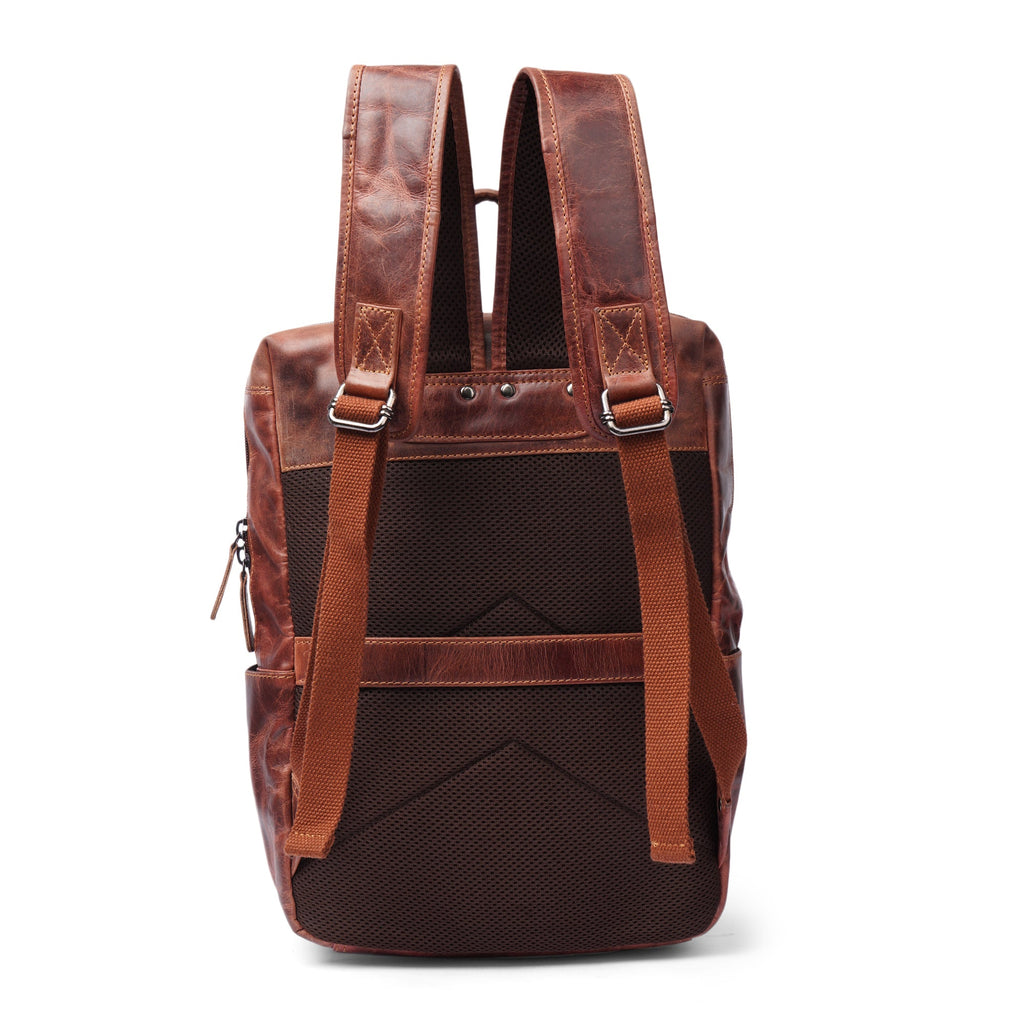 Minori Leather Oslo leather backpack with 15.6-inch laptop compartment, featuring a sleek design and sturdy leather construction.