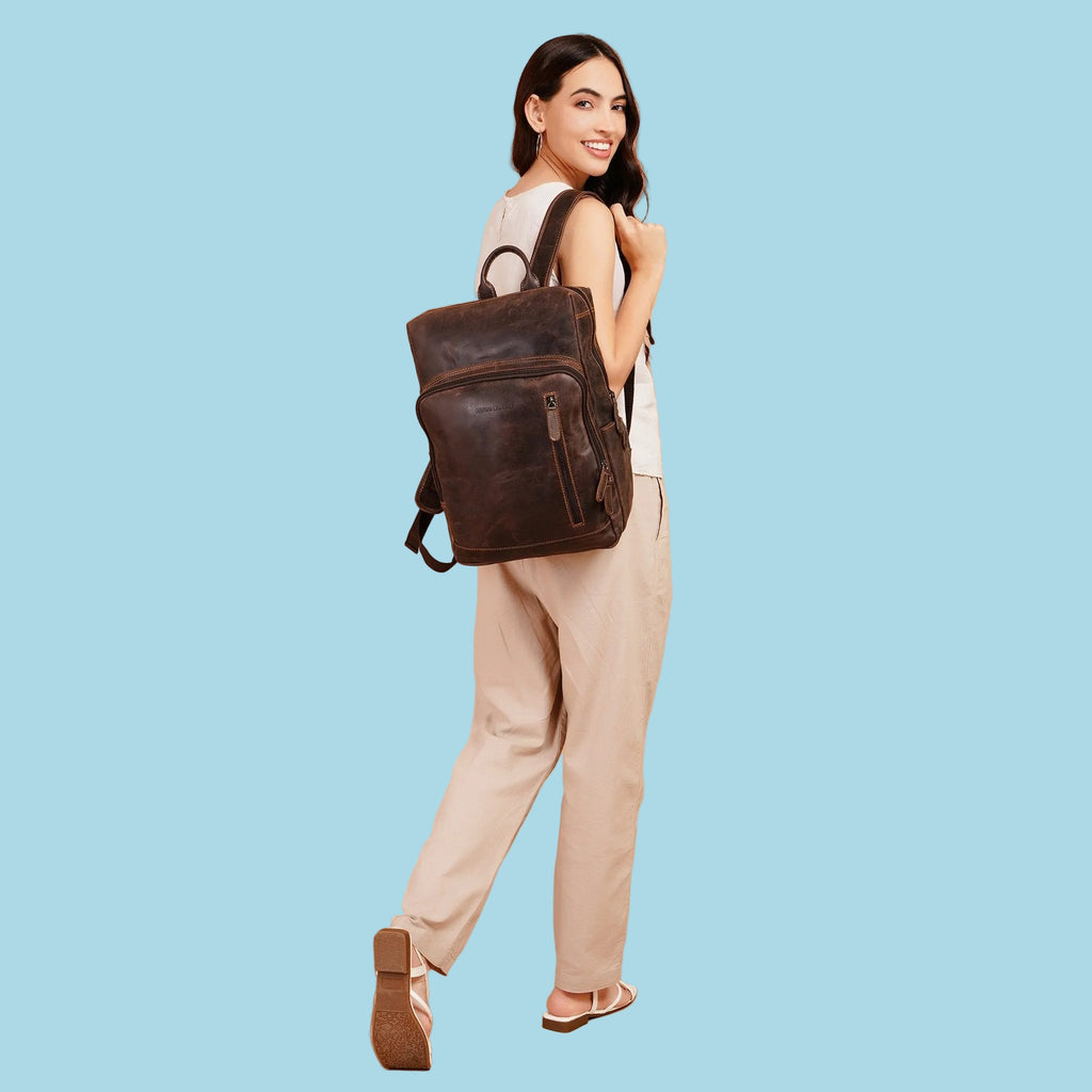 Minori Leather Oslo Leather Laptop Backpack for 15.6-inch laptops, featuring a stylish brown leather design and multiple compartments.