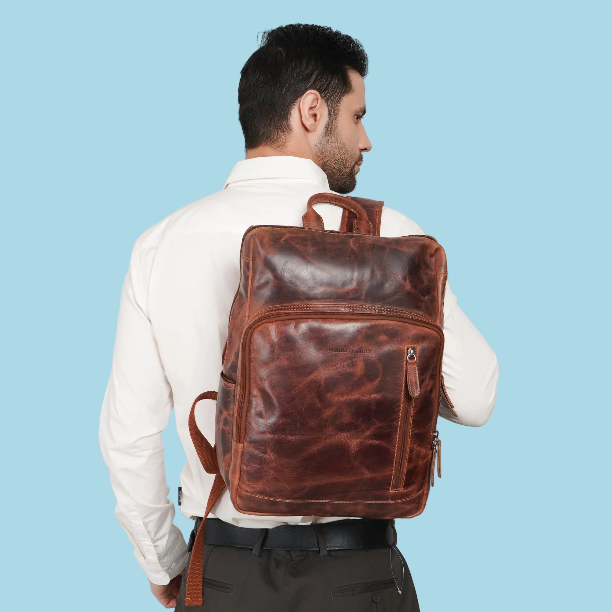 Minori Leather Oslo leather backpack for 15.6-inch laptops, featuring a stylish and durable design with multiple compartments.