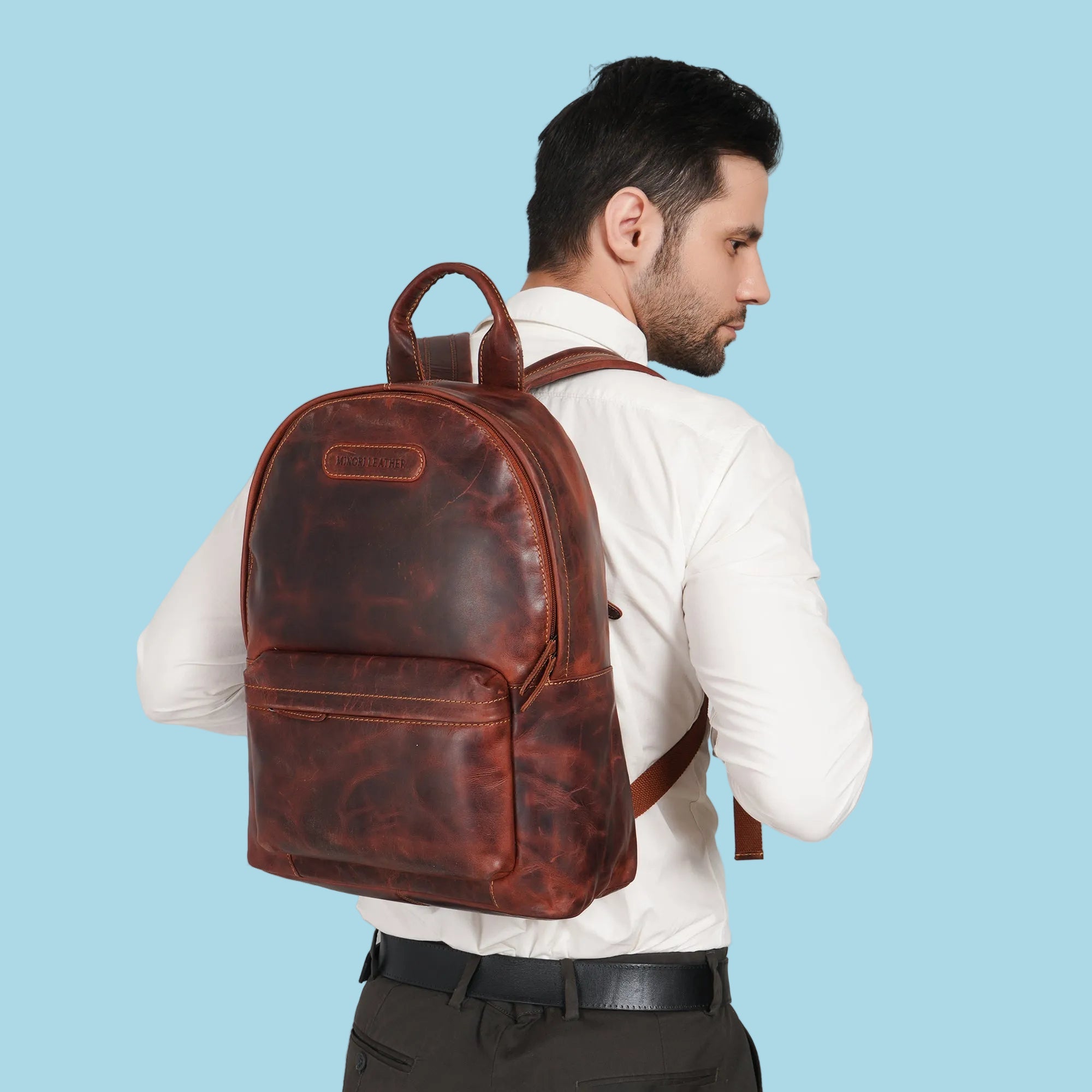Minori Leather Garth Leather Backpack with adjustable straps and multiple compartments, made from durable brown leather.