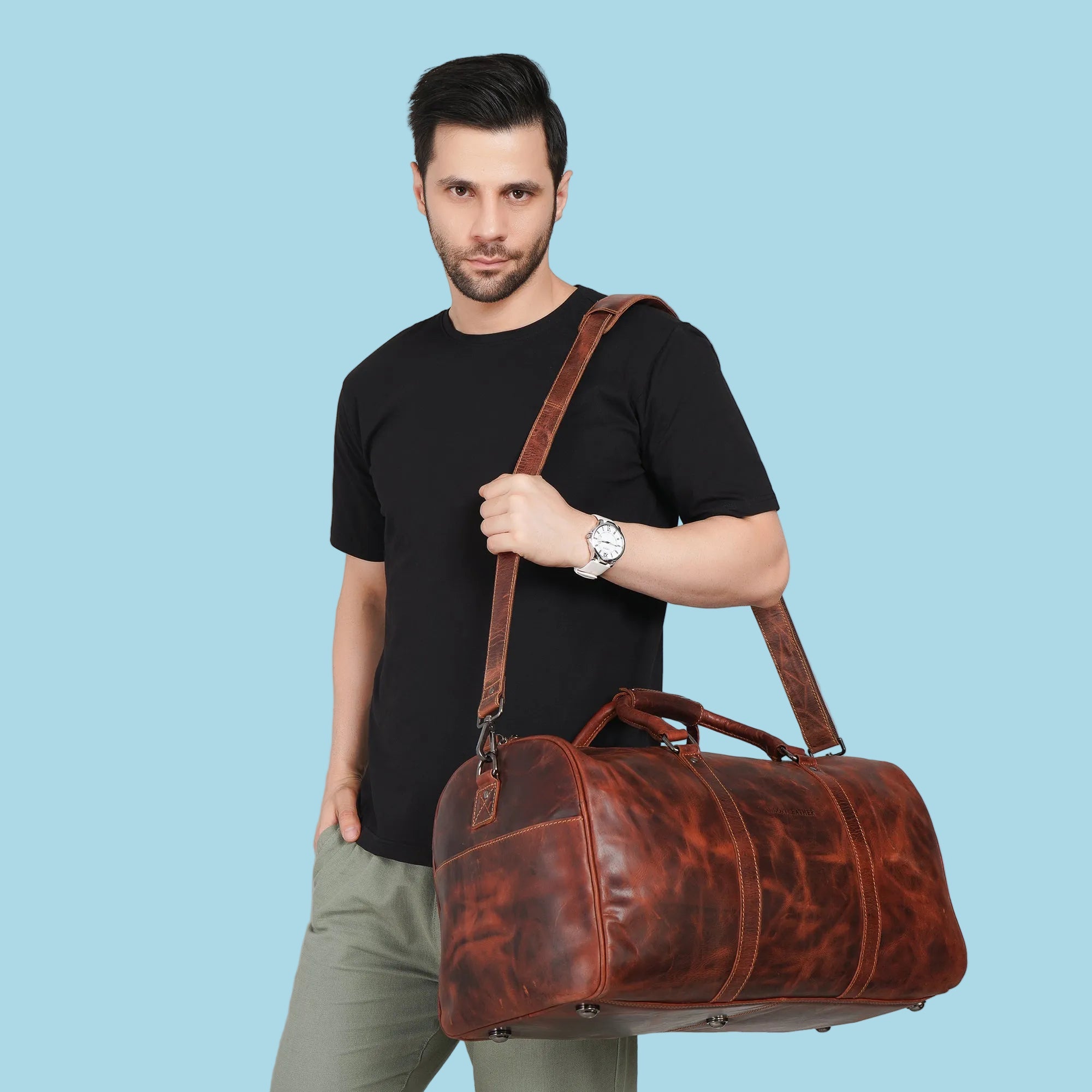 Minori Leather Jackson leather weekender duffle bag with sturdy handles and spacious interior for travel storage.