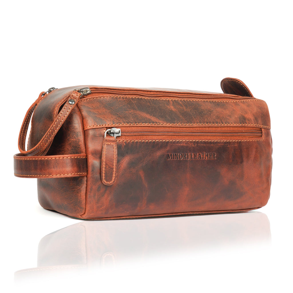 Minori Leather premium chestnut leather toiletry bag for men with multiple compartments and sturdy zipper for travel organization.