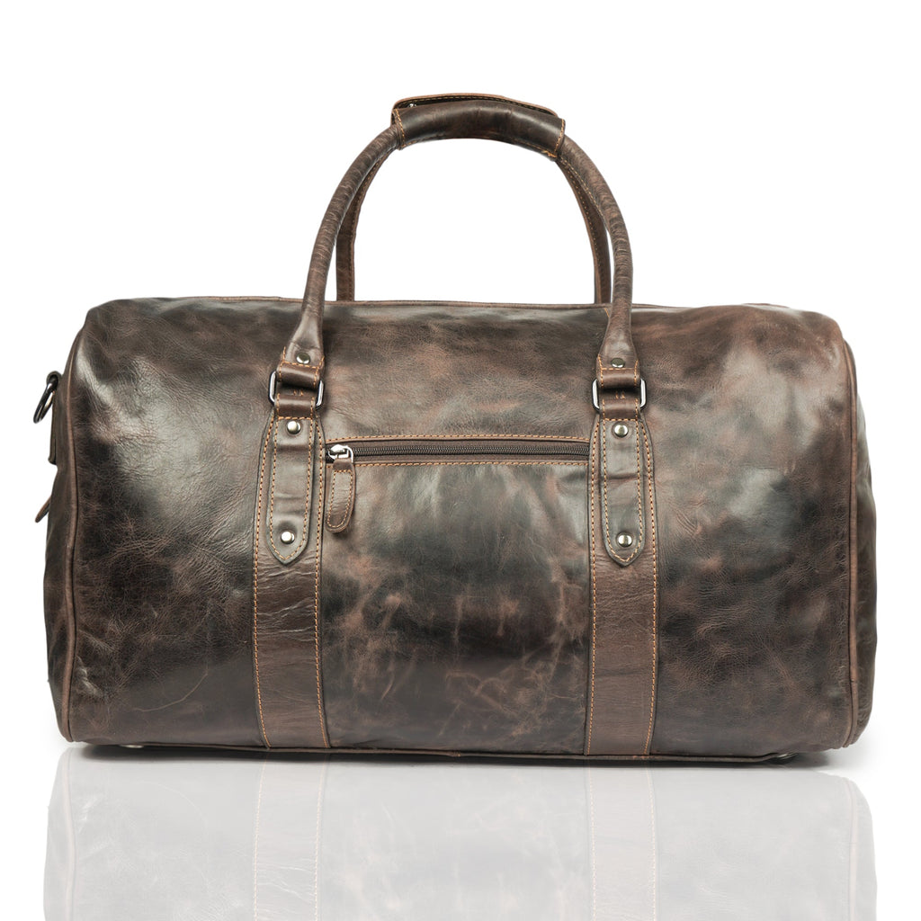 Brown Riley leather duffle bag by Minori Leather, featuring sturdy handles and spacious interior for travel or gym use.